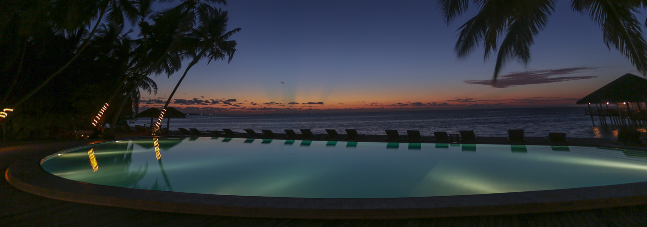 Medhufushi resort Maldives main pool evening