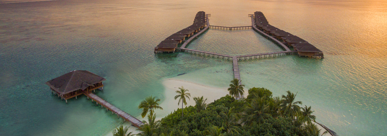 Medhufushi resort Maldives aerial 3 sunset