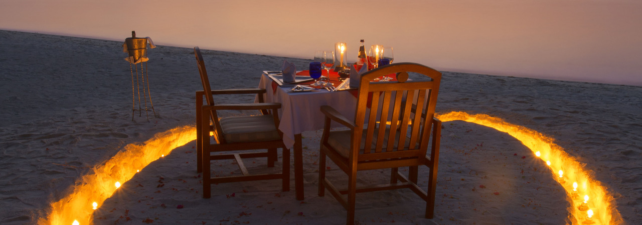 Medhufushi resort Maldives private romantic dinner at sunset