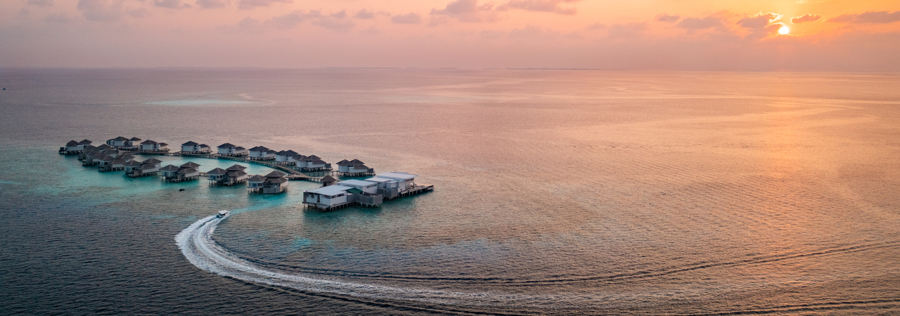 The Halcyon Private Isles Maldives water villas aerial