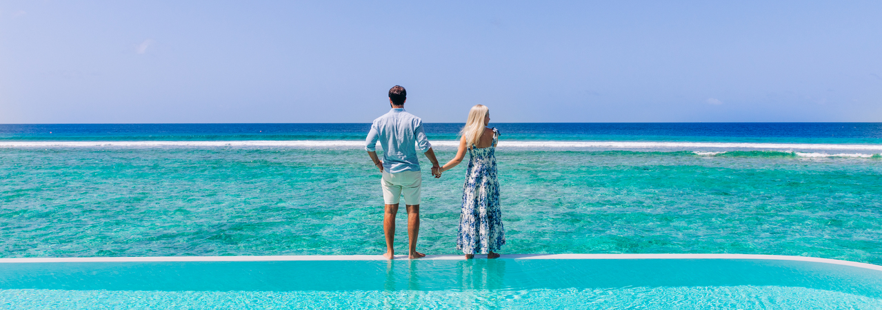 Soneva Fushi resort Maldives couple by the pool