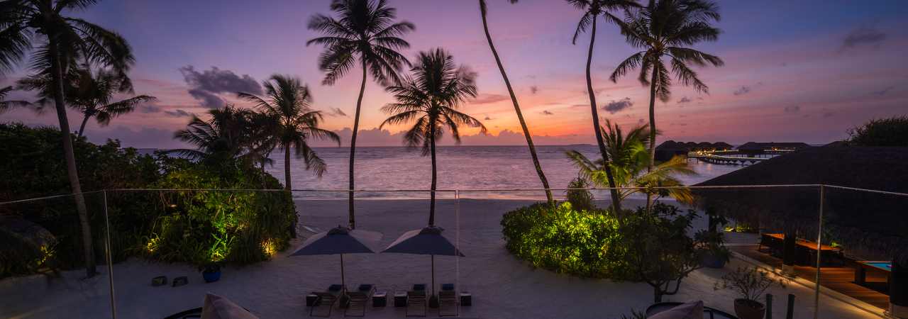 Velaa Private Island resort Maldives sunset palm trees 2
