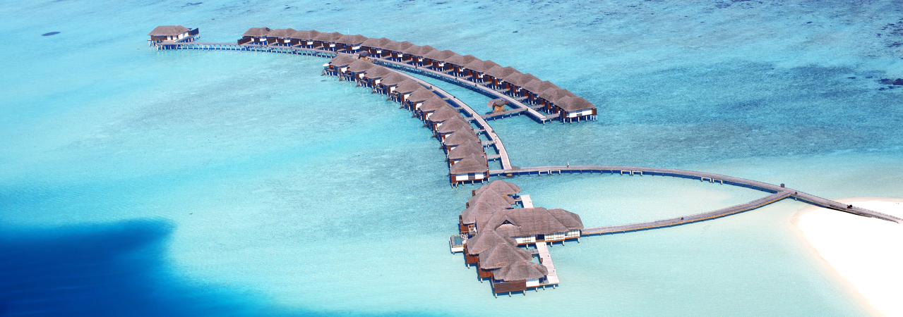 Velassaru Island Resort Maldives aerial water villas